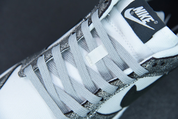 nike dunk low features silver cracked leather do5882-001